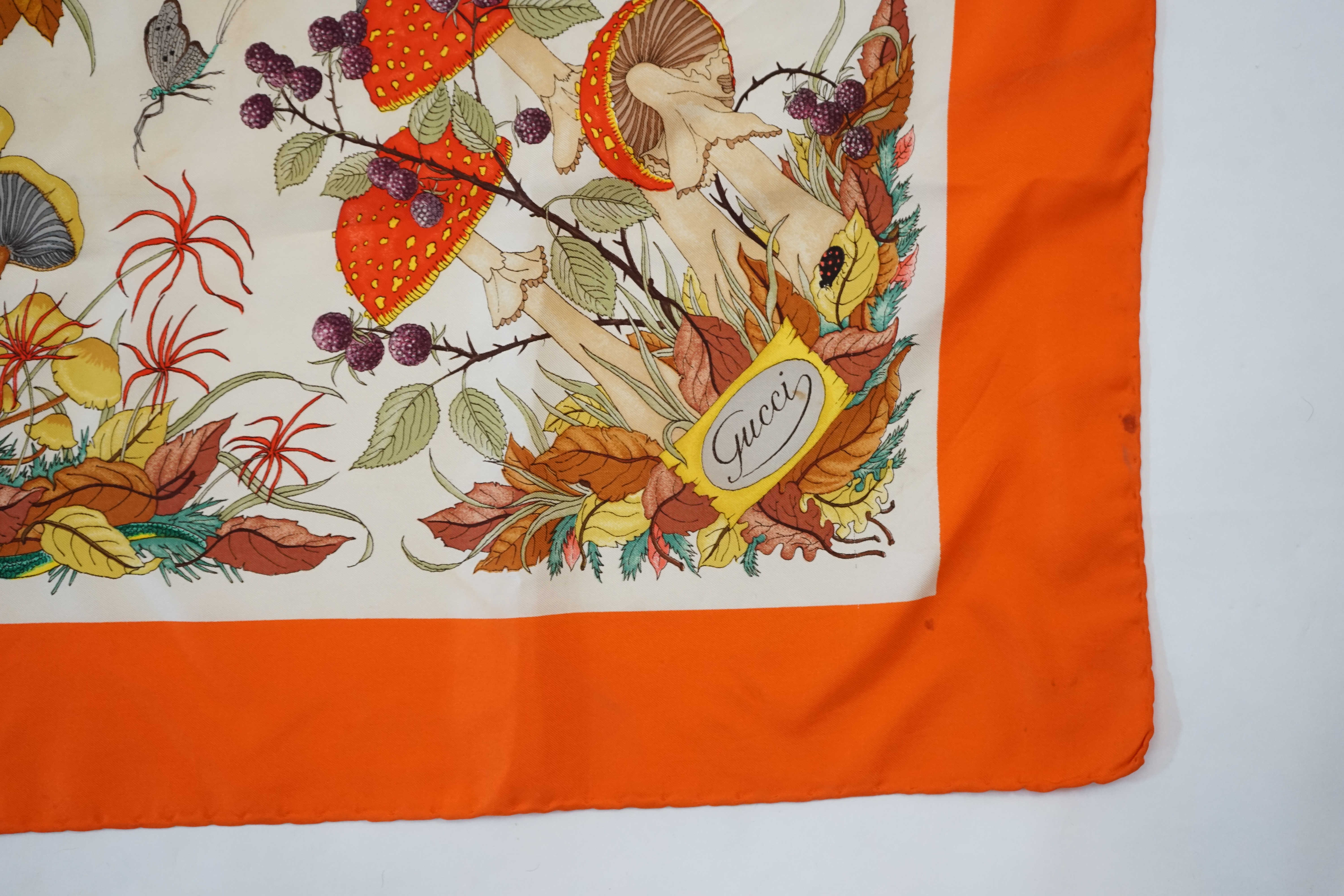 A Gucci vintage red floral silk scarf 'Funghi Mushrooms' by Vittorio Accornero, 87cm x 85cm